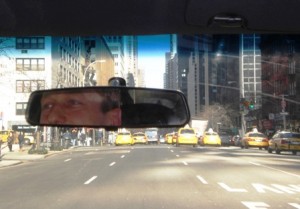 Huseyin-and-yellow-taxis Huseyin Kamal surveying the road. Photo by Lilian Moreira