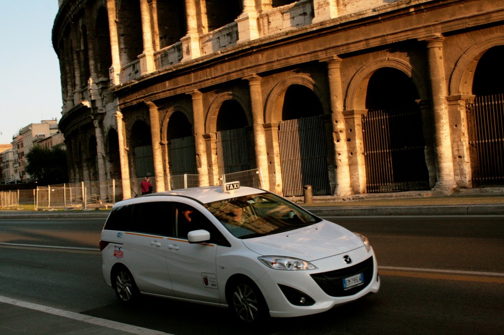 Rome taxi colosseum by Rumen Milkow