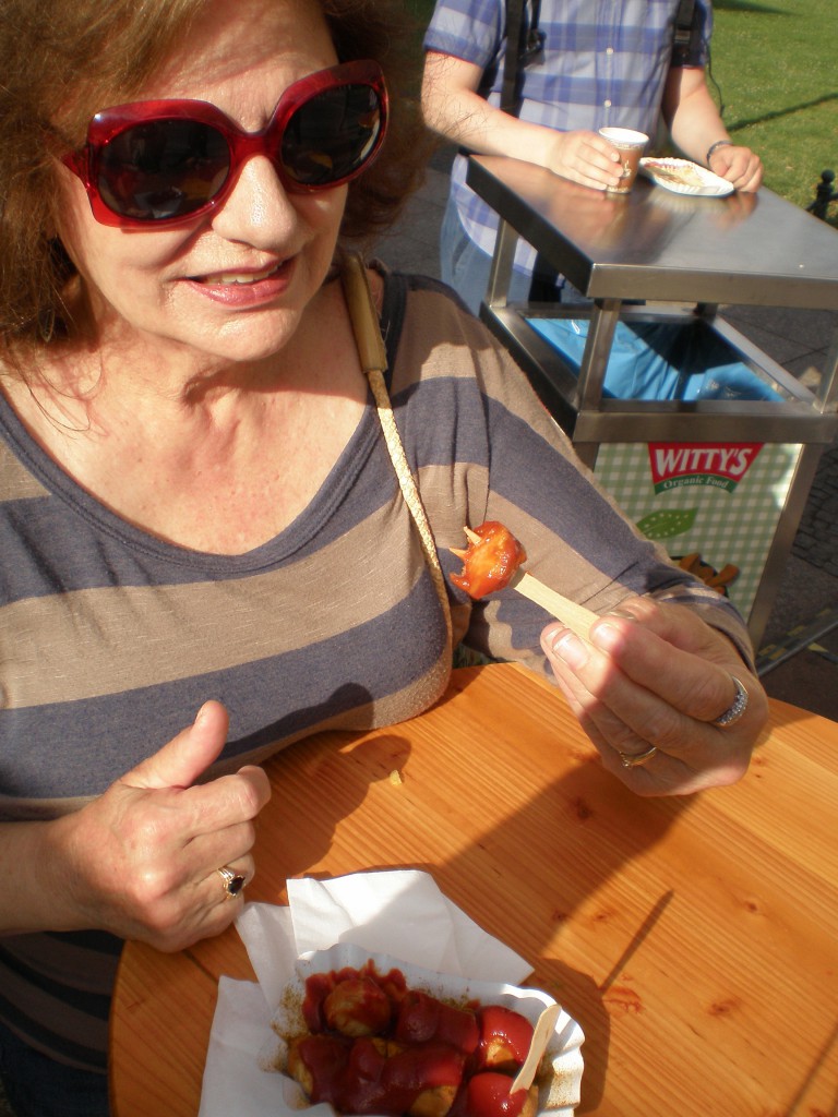 Mom looking skeptical before her first bite of curry wurst.
